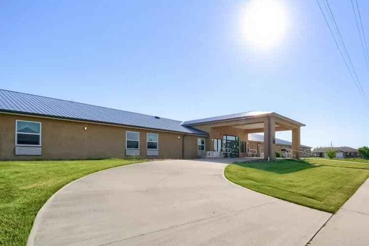 Aspen Leaf 6th Street exterior with covered entrance and curved driveway in Limon