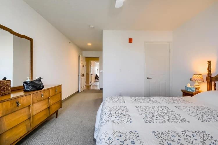Bright private resident room with dresser and full bed at Aspen Leaf 6th Street